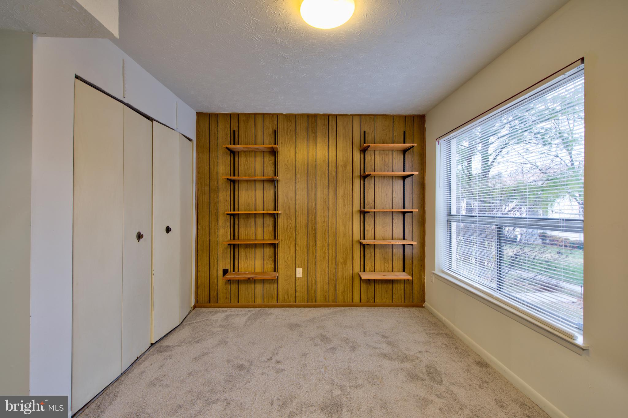 8011 Mandan Road, Unit 201 Greenbelt, MD 20770 - Photo 15 of 28 a view of an empty room with a window