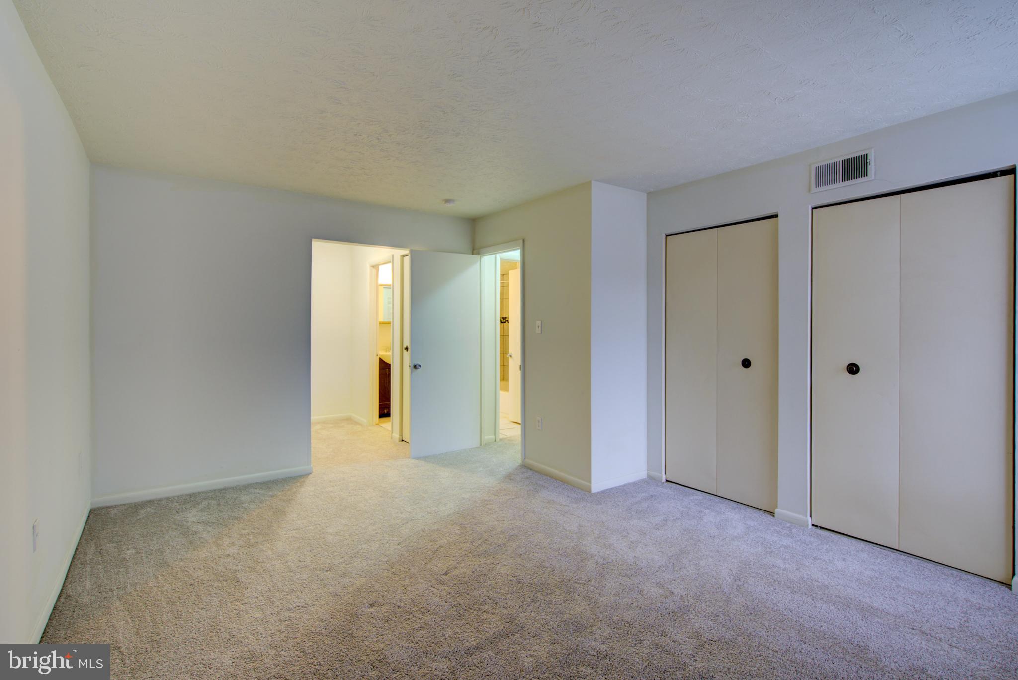 8011 Mandan Road, Unit 201 Greenbelt, MD 20770 - Photo 23 of 28 a view of an empty room