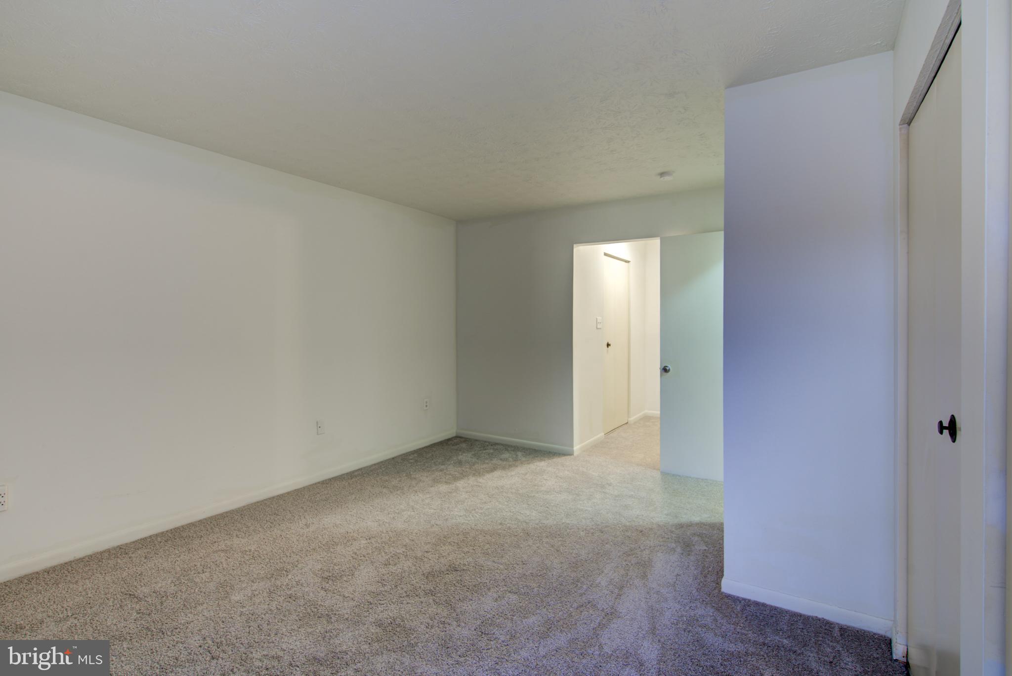 8011 Mandan Road, Unit 201 Greenbelt, MD 20770 - Photo 25 of 28 a view of an empty room