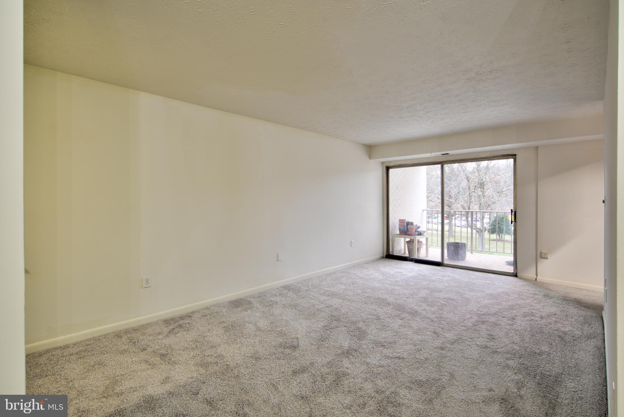 8011 Mandan Road, Unit 201 Greenbelt, MD 20770 - Photo 10 of 28 an empty room with windows
