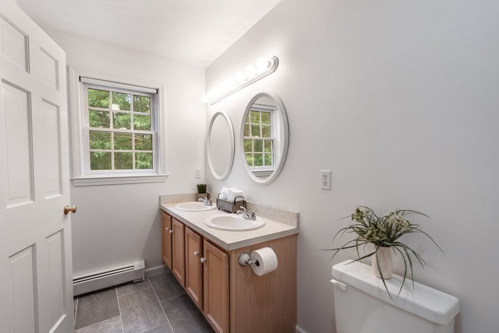 6 Farrar Road Upton, MA 01568 - Photo 28 of 42 a bathroom with a sink a mirror and a window