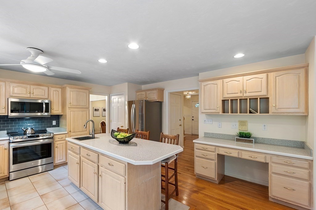 6 Farrar Road Upton, MA 01568 - Photo 9 of 42 a kitchen with stainless steel appliances a stove a sink a microwave a refrigerator and cabinets