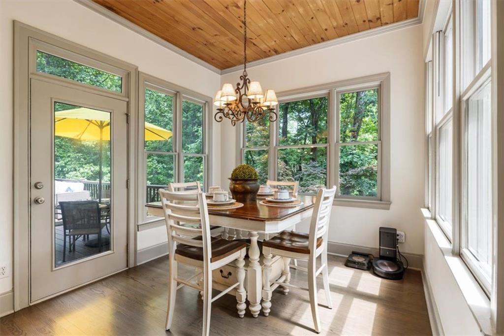 3910 Two Rivers Drive Cumming, GA 30041 - Photo 26 of 110 a dining room with furniture large windows and wooden floor