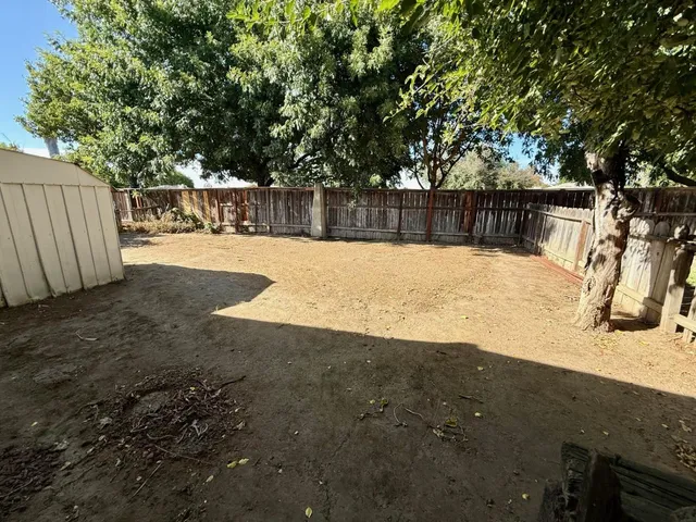 a front view of a house with a snow yard