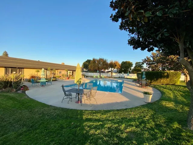 a view of a swimming pool with an ocean view