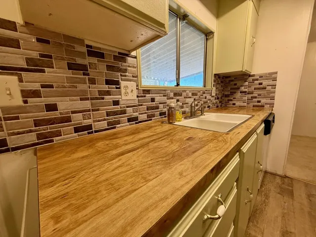 a view of a kitchen with a sink
