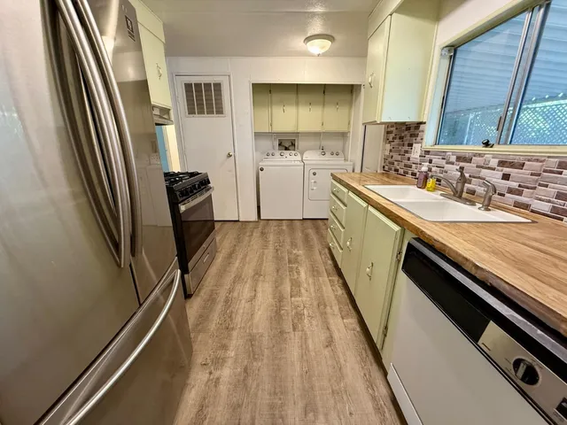 a stove top oven sitting inside of a kitchen