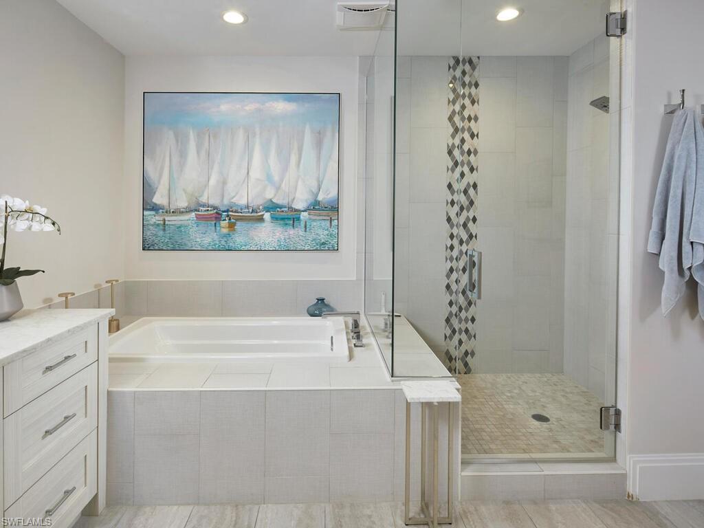 1135 3rd Avenue South Naples, FL 34102 - Photo 14 of 35 a bathroom with a bathtub a shower and a sink