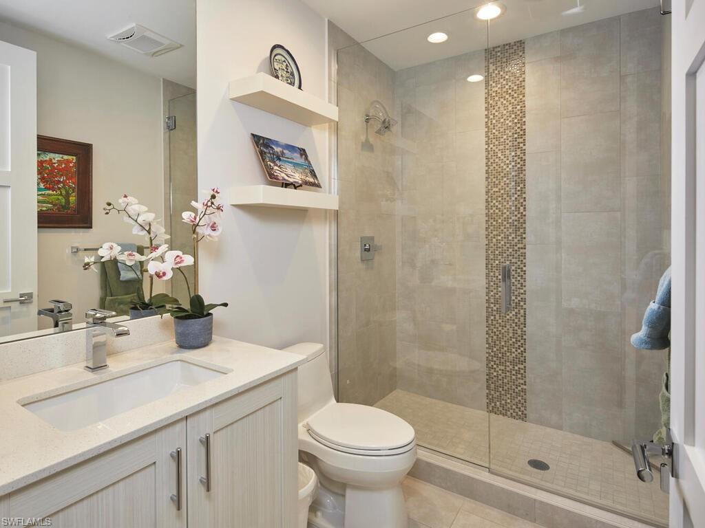 1135 3rd Avenue South Naples, FL 34102 - Photo 17 of 35 a bathroom with a sink toilet and shower
