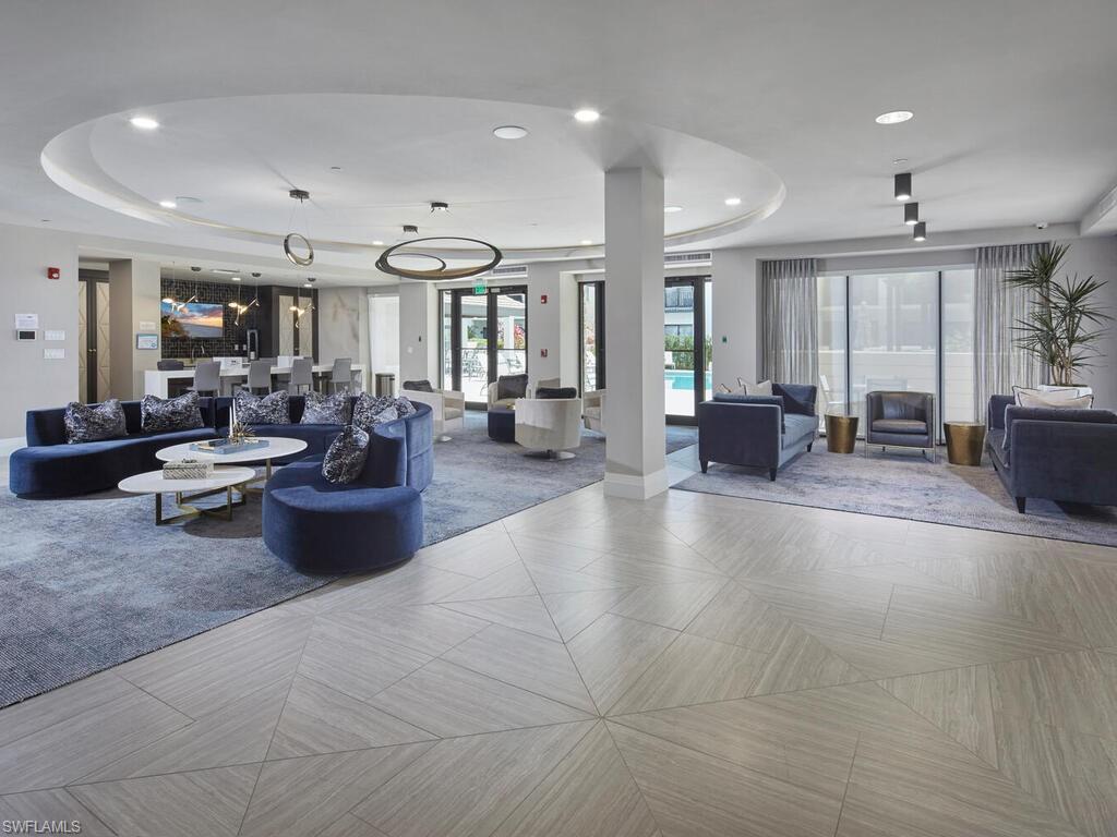1135 3rd Avenue South Naples, FL 34102 - Photo 27 of 35 a living room with furniture and large windows