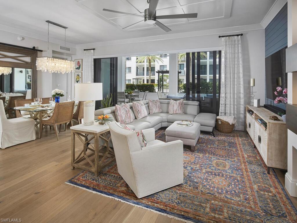 1135 3rd Avenue South Naples, FL 34102 - Photo 3 of 35 a living room with furniture and a flat screen tv