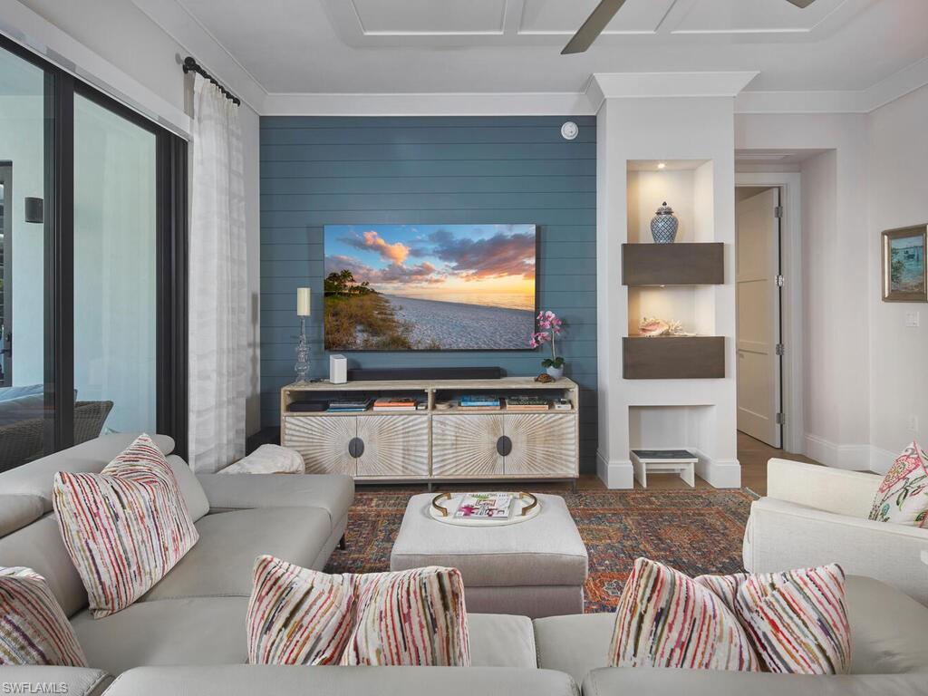 1135 3rd Avenue South Naples, FL 34102 - Photo 4 of 35 a living room with furniture and a flat screen tv