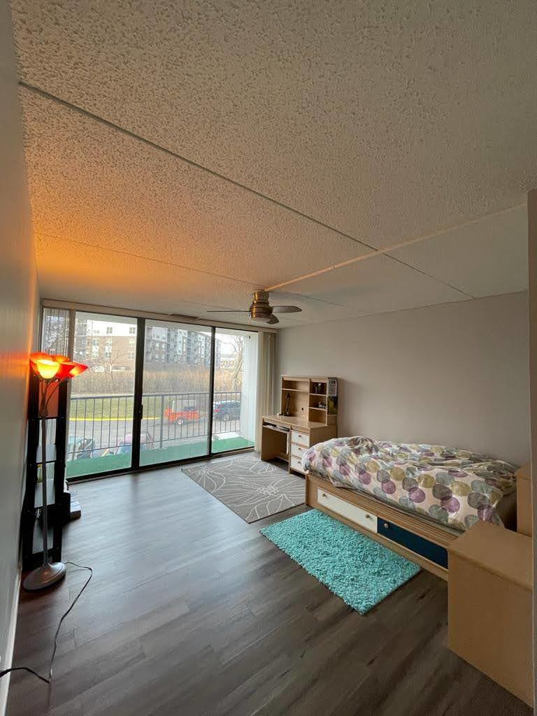 2015 South Finley Road, Unit 212 Lombard, IL 60148 - Photo 12 of 26 a view of livingroom with furniture hardwood floor and a flat screen tv