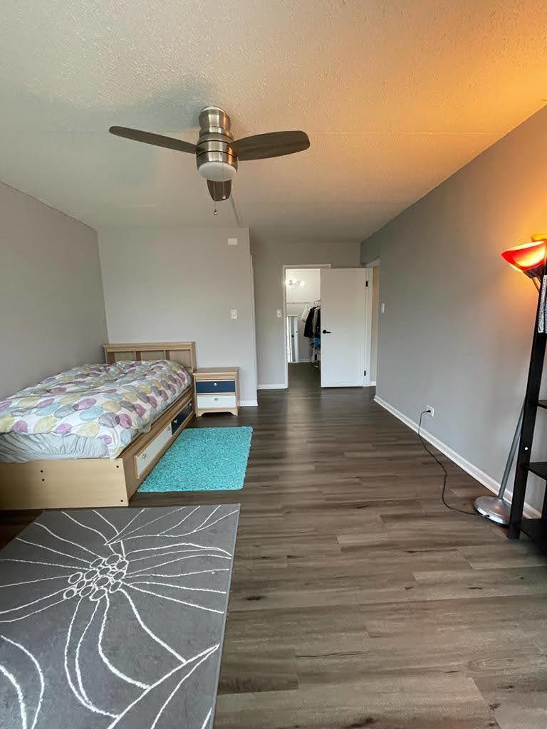 2015 South Finley Road, Unit 212 Lombard, IL 60148 - Photo 16 of 26 a room with gym equipment and wooden floor