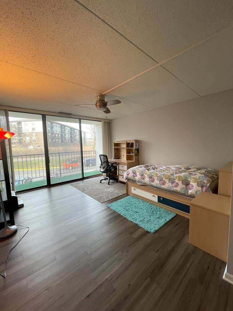 2015 South Finley Road, Unit 212 Lombard, IL 60148 - Photo 20 of 26 a living room with furniture stove and wooden floor