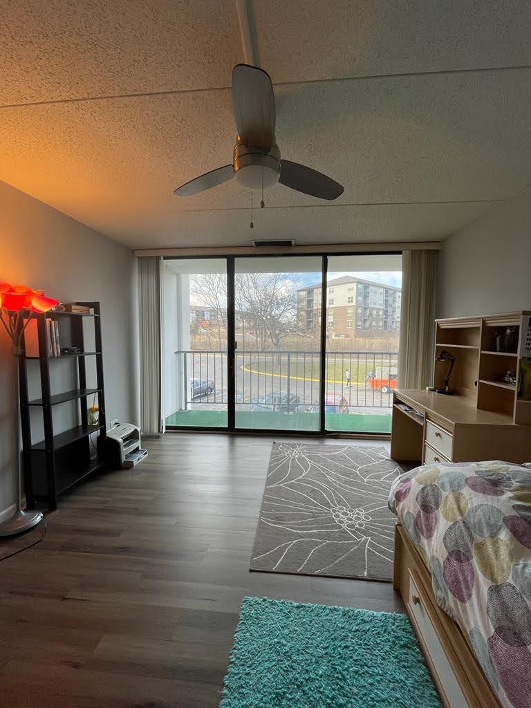 2015 South Finley Road, Unit 212 Lombard, IL 60148 - Photo 21 of 26 a bedroom with a large bed and a large window