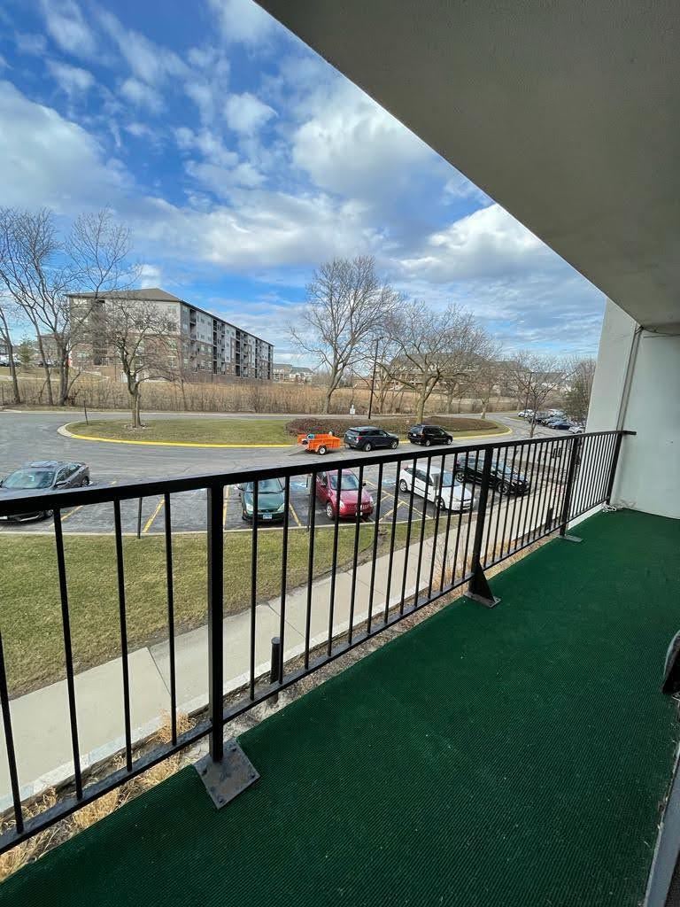 2015 South Finley Road, Unit 212 Lombard, IL 60148 - Photo 23 of 26 a view of a balcony with an outdoor space