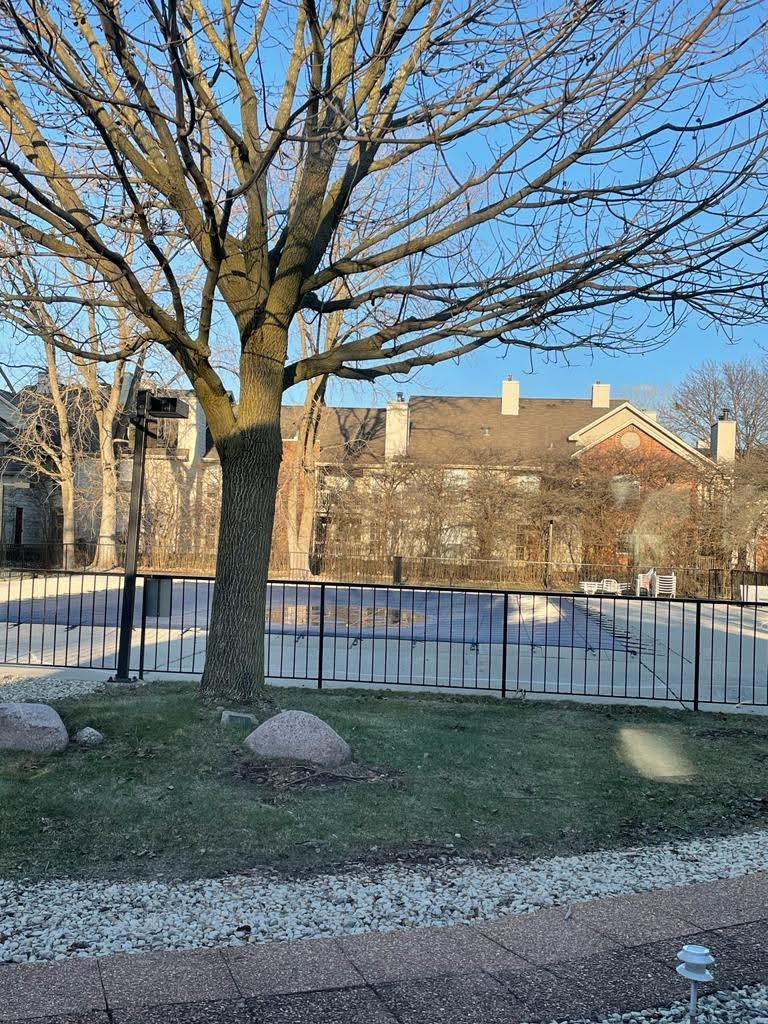 2015 South Finley Road, Unit 212 Lombard, IL 60148 - Photo 25 of 26 a view of a yard with a tree