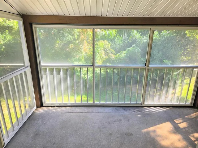 a view of outdoor space with sliding window