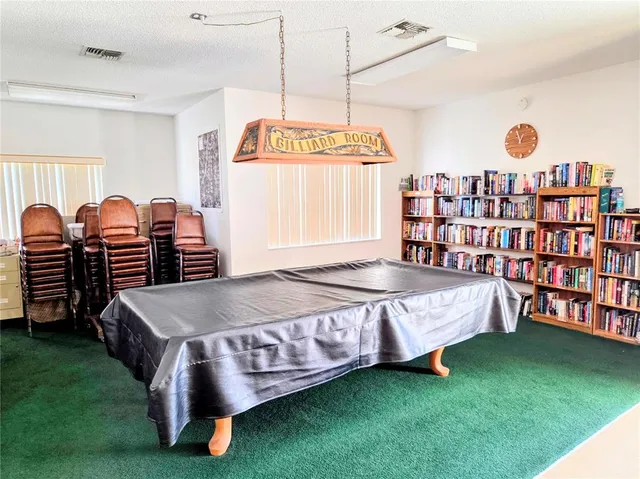 a bed room with a bed and a bookshelf