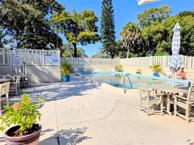 a view of a swimming pool with a patio