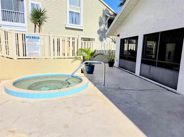 a swimming pool with outdoor seating