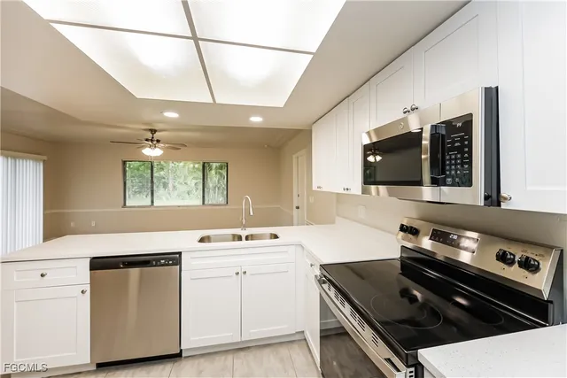 a kitchen that has a sink and a stove
