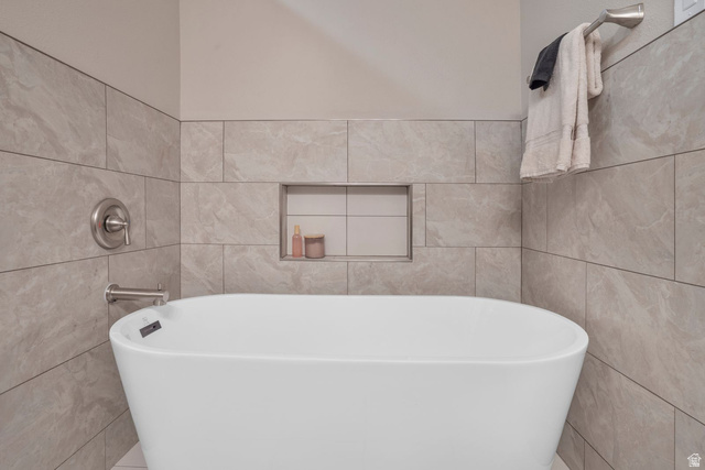 1570 South Rio Virgin Drive Washington, UT 84780 - Photo 33 of 71 Full bathroom featuring a freestanding tub and tile walls