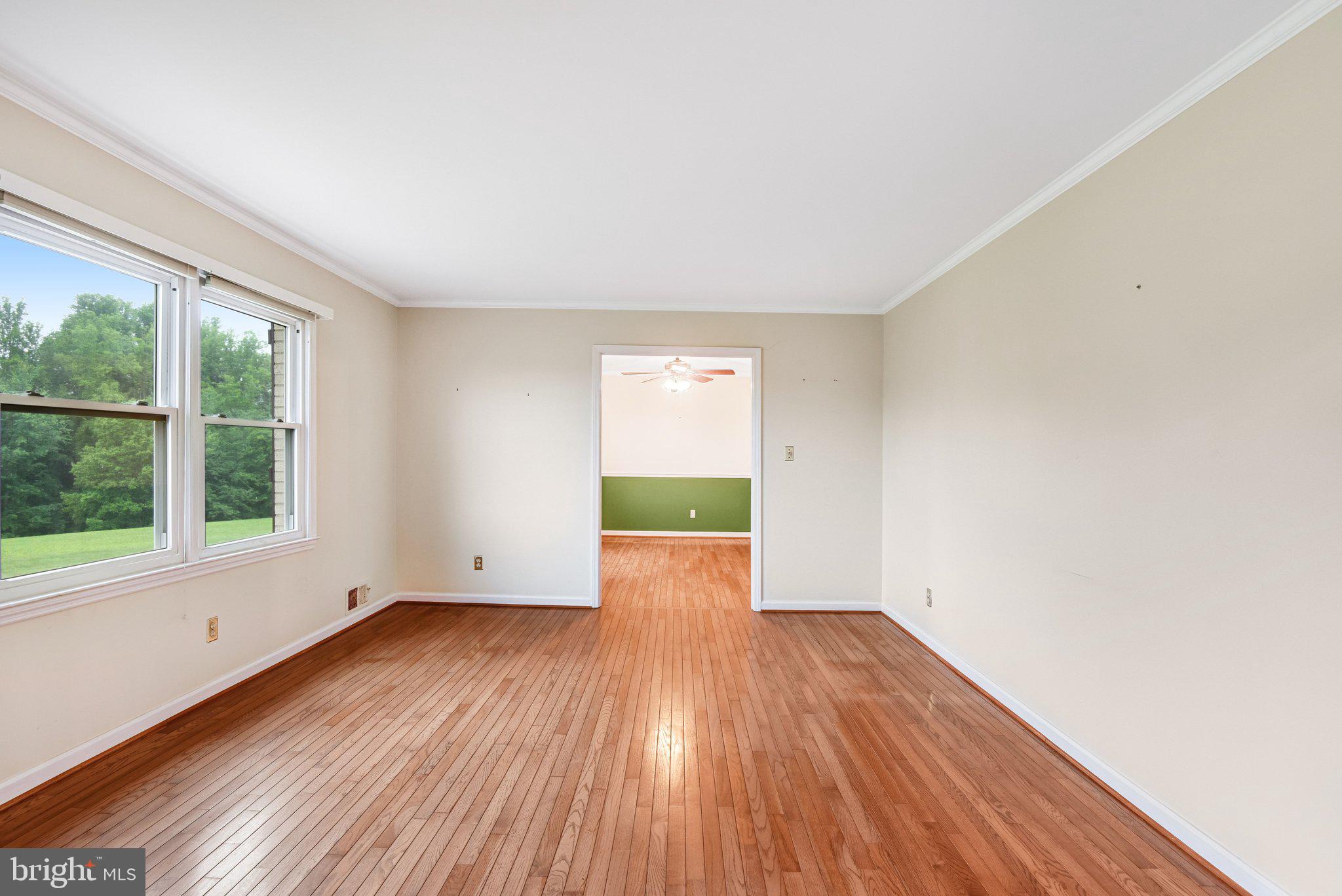 7961 Leeds Manor Road Marshall, VA 20115 - Photo 6 of 40 an empty room with wooden floor and windows