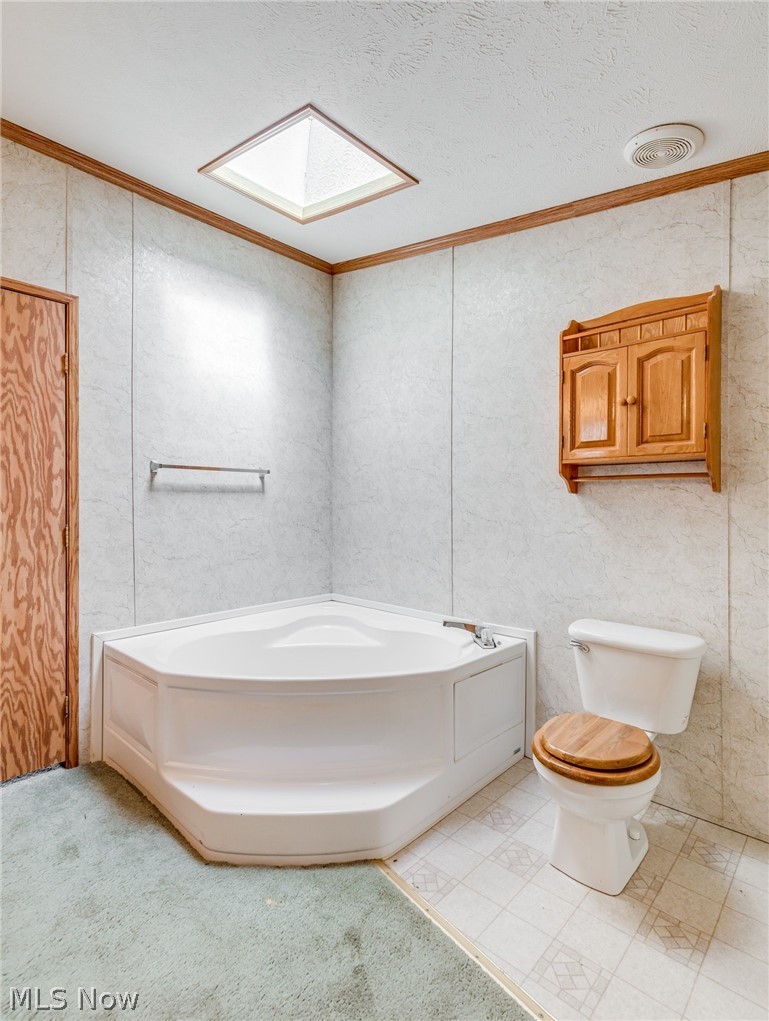 4080 Johnson Road Norton, OH 44203 - Photo 28 of 33 soaker tub and skylight in master bath shower not shown but to right of toilet