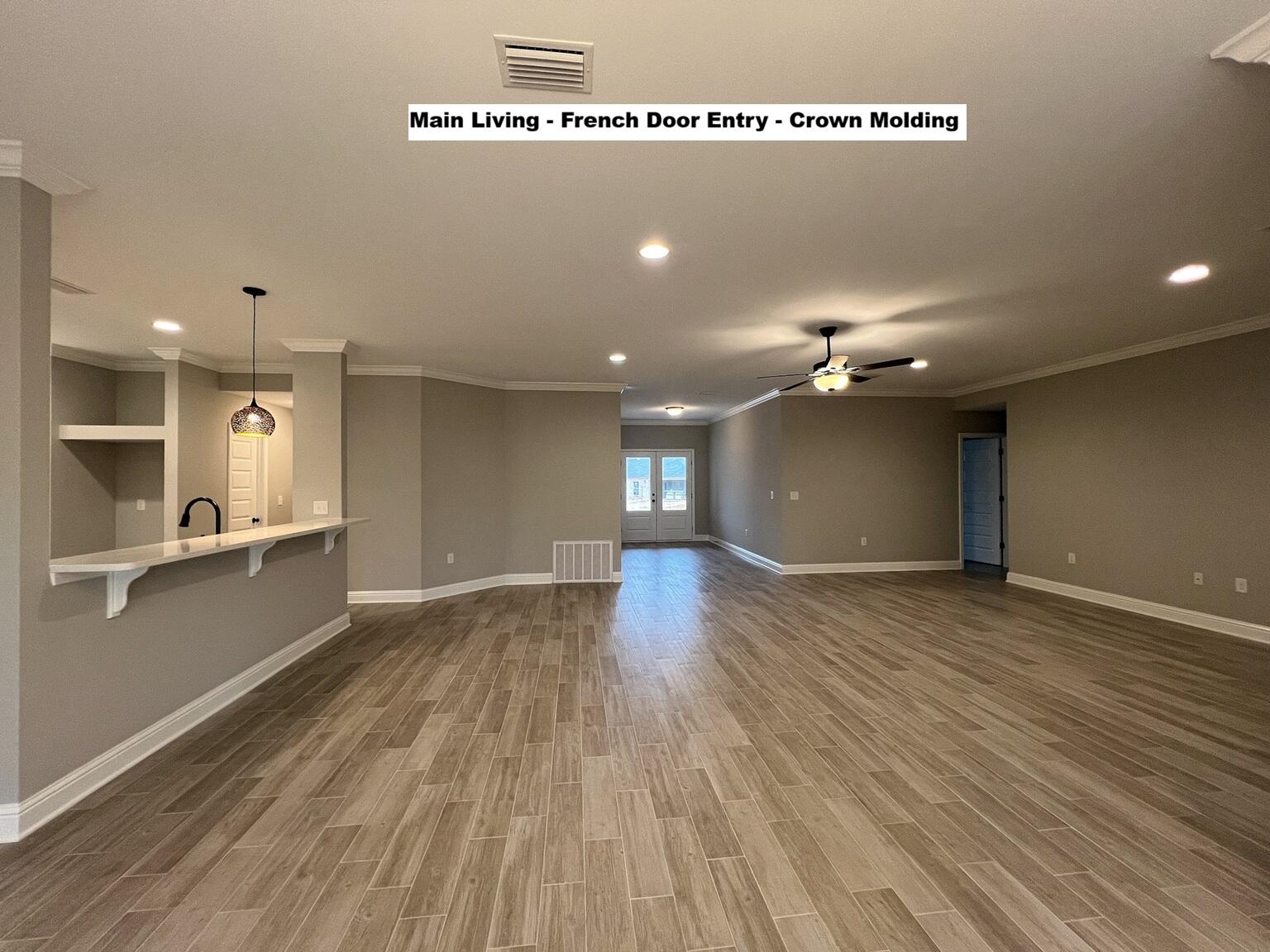 4644 Chanteuse Parkway Crestview, FL 32539 - Photo 11 of 34 a view of an empty room with wooden floor