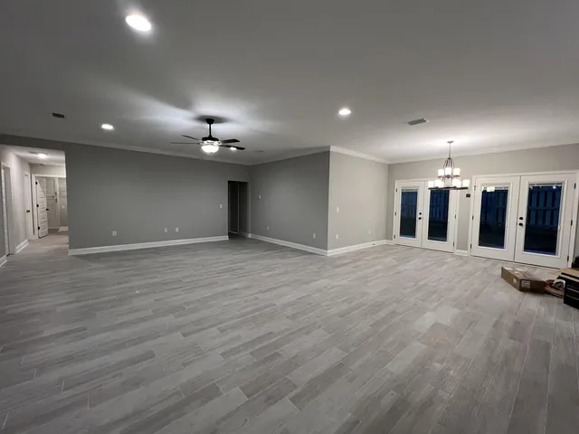 an empty room with wooden floor