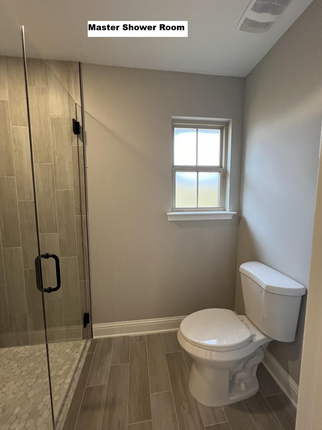 4644 Chanteuse Parkway Crestview, FL 32539 - Photo 13 of 34 a bathroom with a toilet and a shower