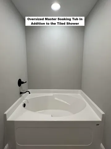 a bathroom with a sink a mirror and a bathtub