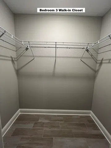 a view of a room with racks on the wall