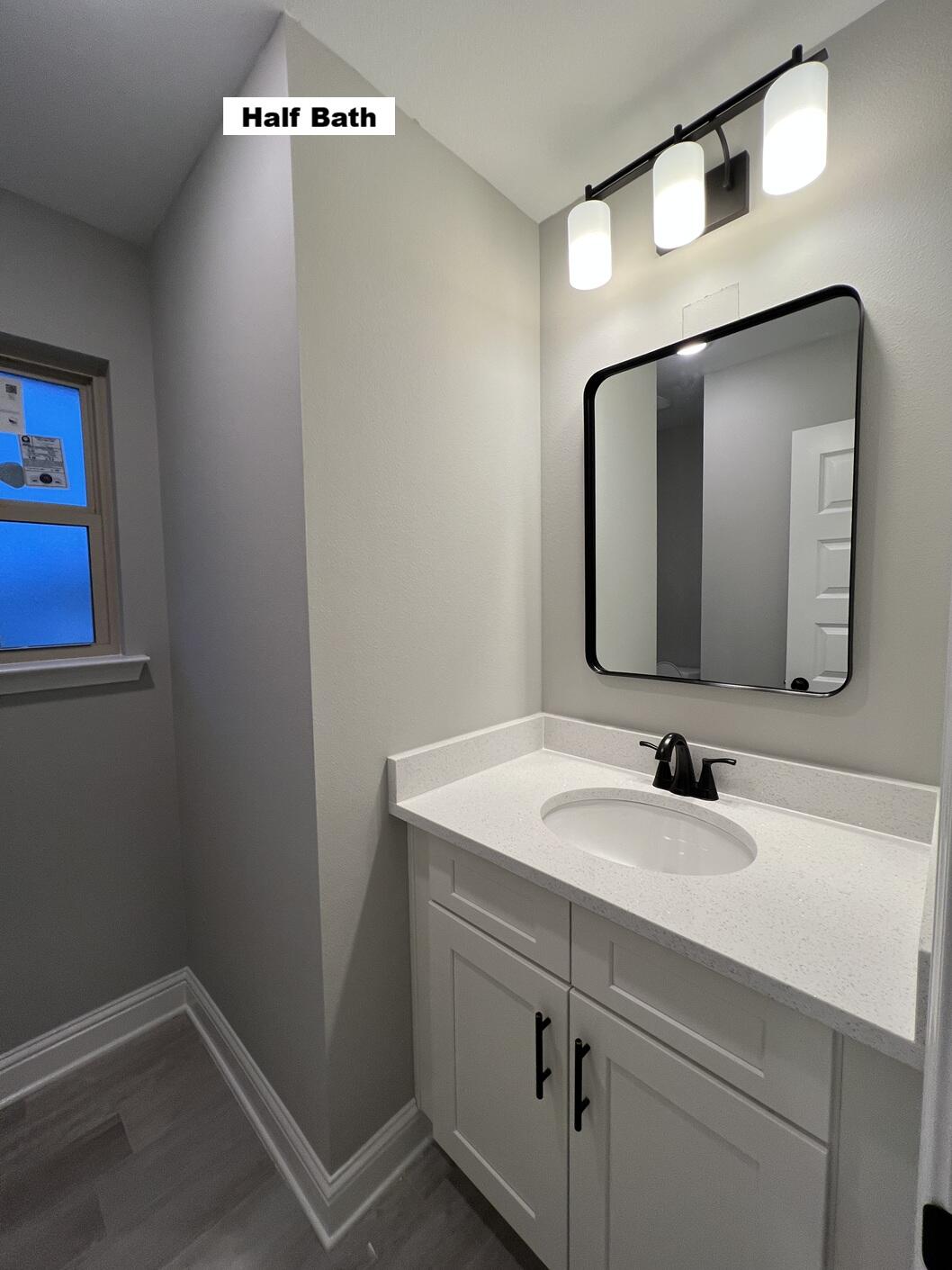 4644 Chanteuse Parkway Crestview, FL 32539 - Photo 26 of 34 a bathroom with a sink and a mirror