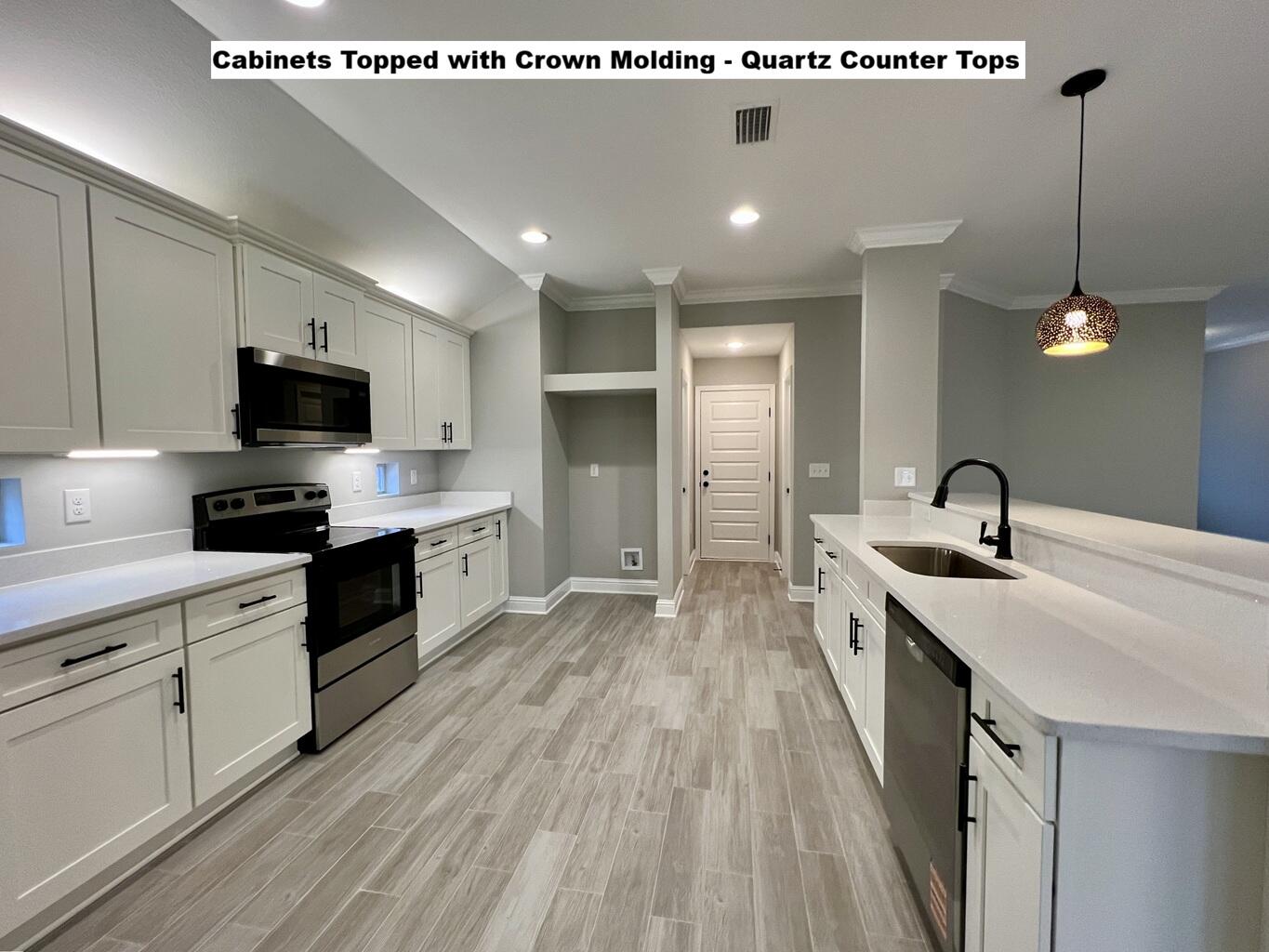 4644 Chanteuse Parkway Crestview, FL 32539 - Photo 4 of 34 a kitchen with stainless steel appliances granite countertop a sink stove and refrigerator