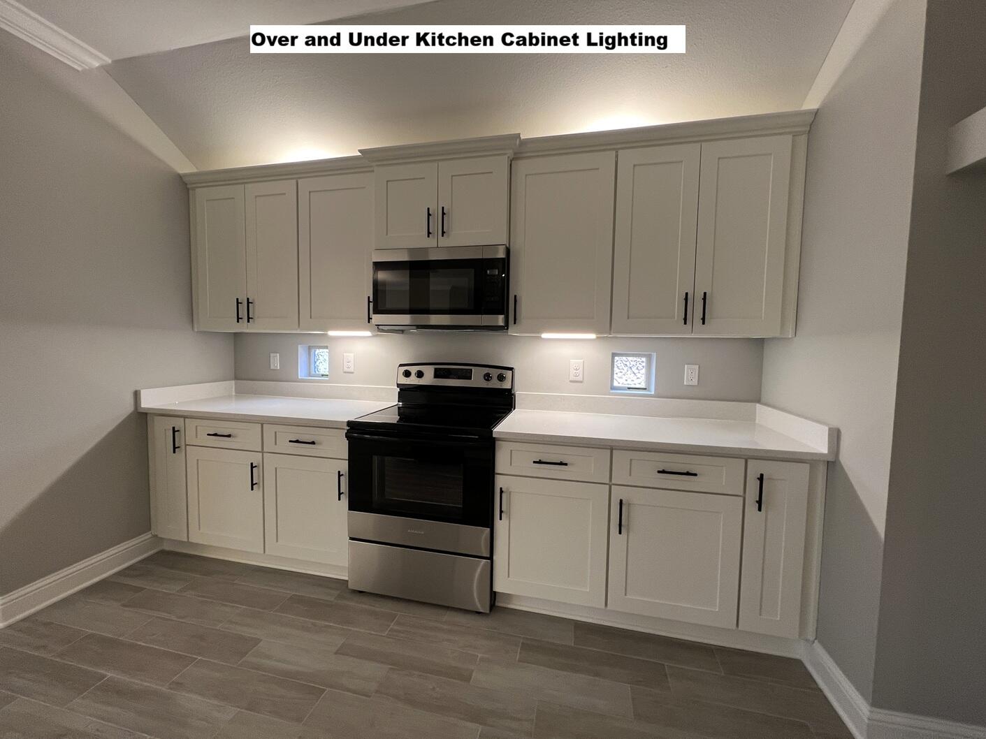 4644 Chanteuse Parkway Crestview, FL 32539 - Photo 5 of 34 a kitchen with white cabinets stainless steel appliances and sink