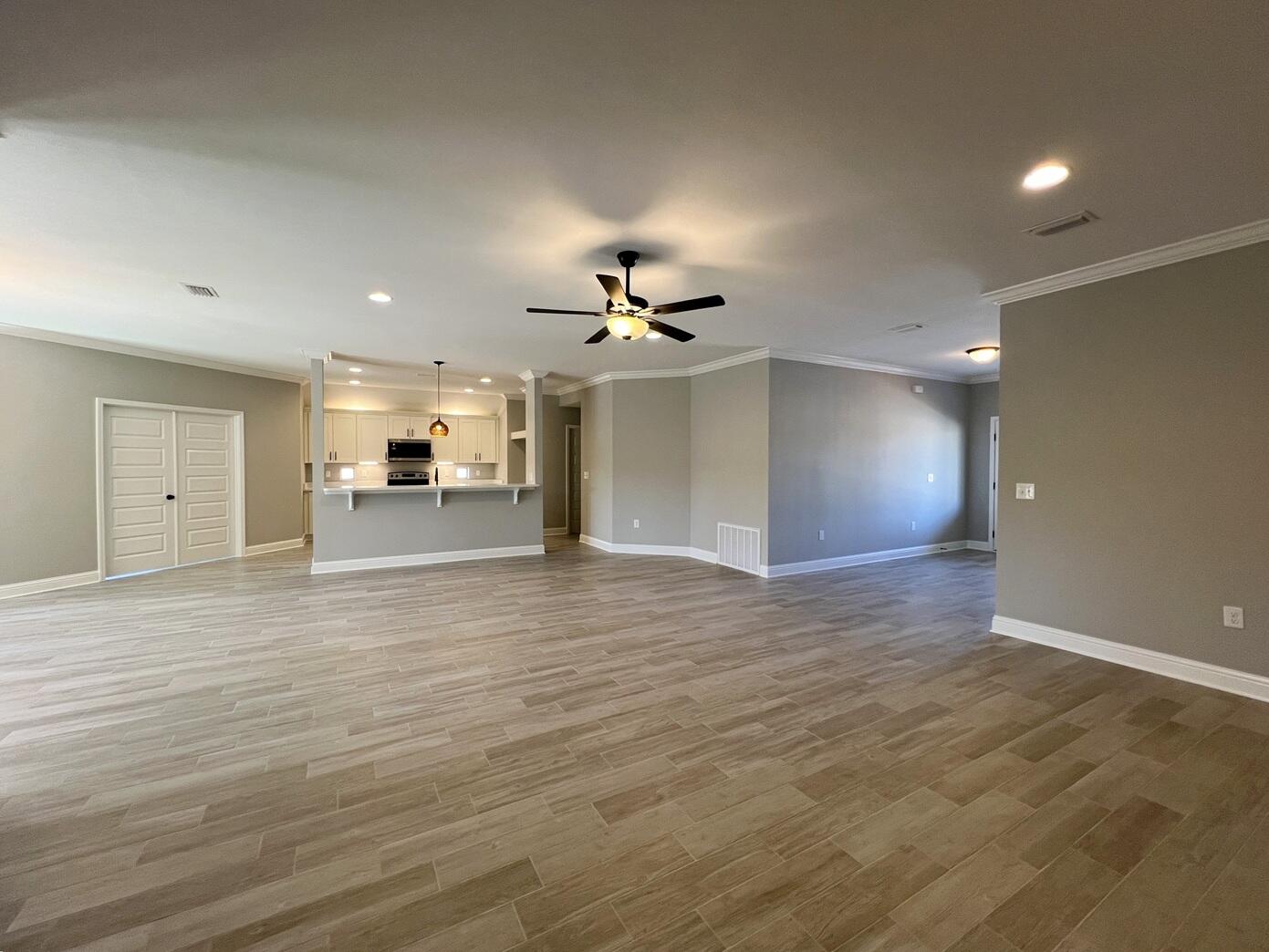 4644 Chanteuse Parkway Crestview, FL 32539 - Photo 8 of 34 a view of a livingroom with a kitchen