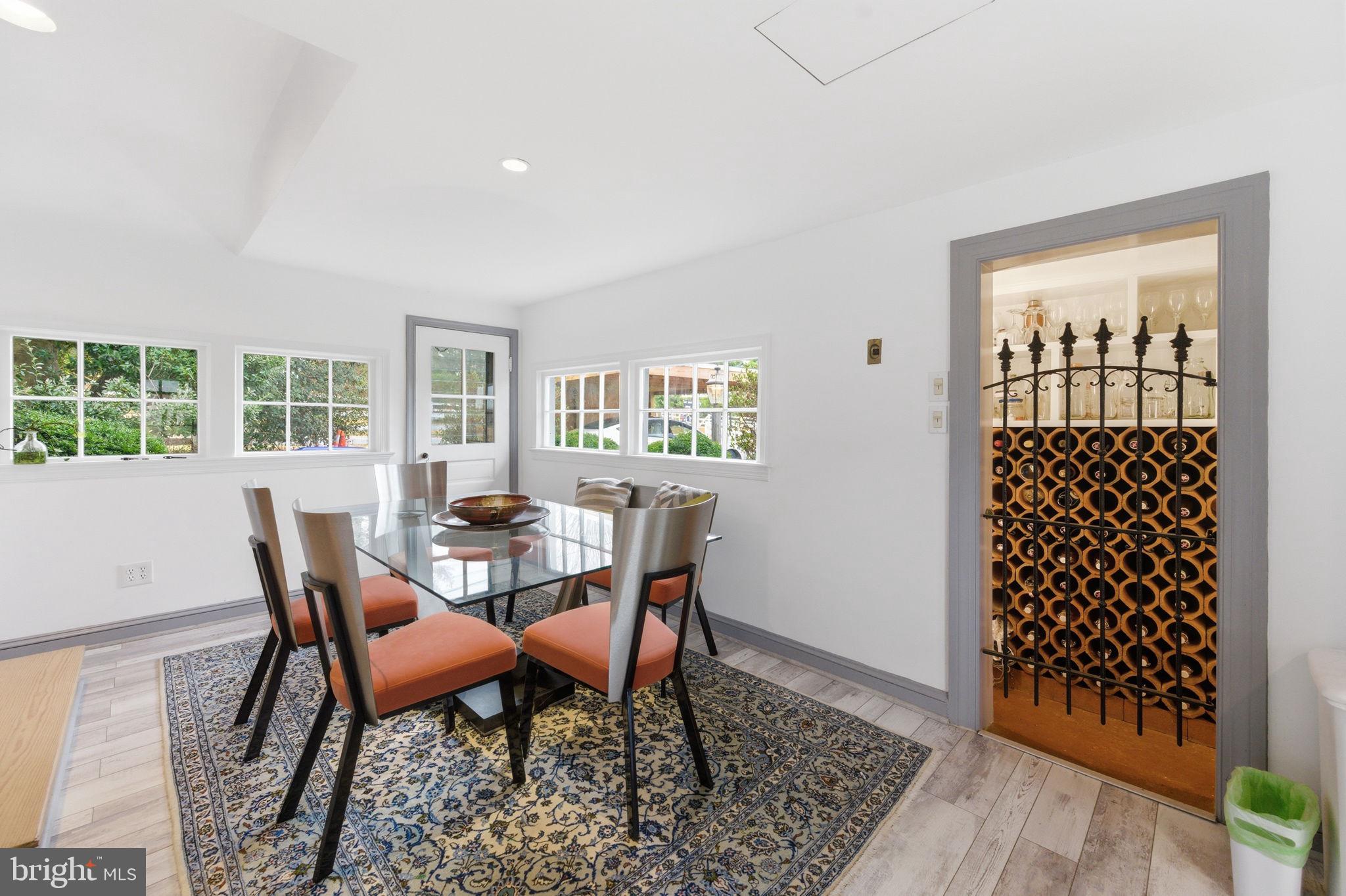 11641 Glen Road Potomac, MD 20854 - Photo 16 of 40 a view of a dining room with furniture and wooden floor