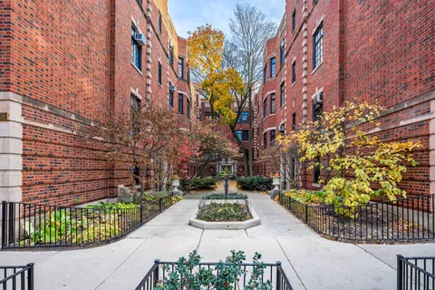 a view of a garden with a house