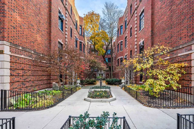 a view of a garden with a house