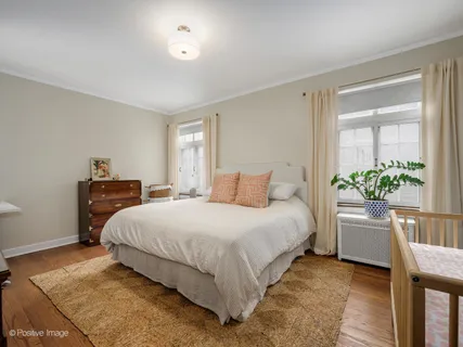 a bedroom with a bed and a table