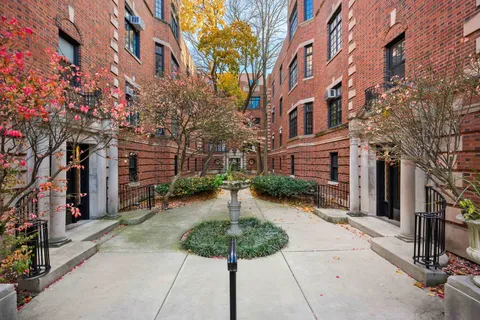 a view of a building with a yard