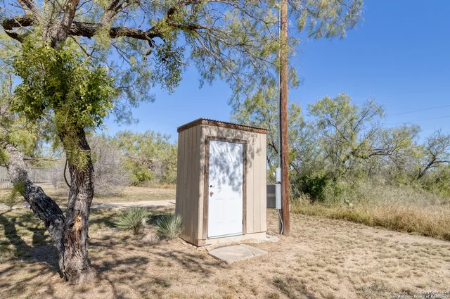 a view of a tree in front of a house