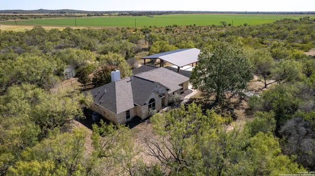 a view of a bathroom with a shower and mirror