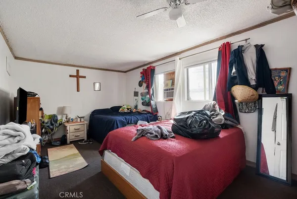 a bedroom with bed and a closet