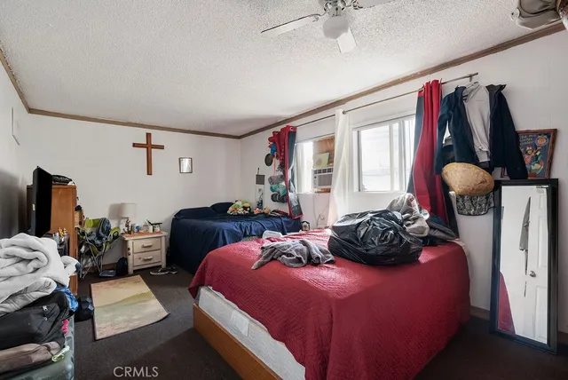 a bedroom with bed and a closet