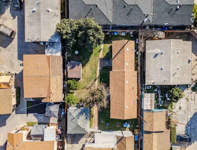 an aerial view of houses with outdoor space