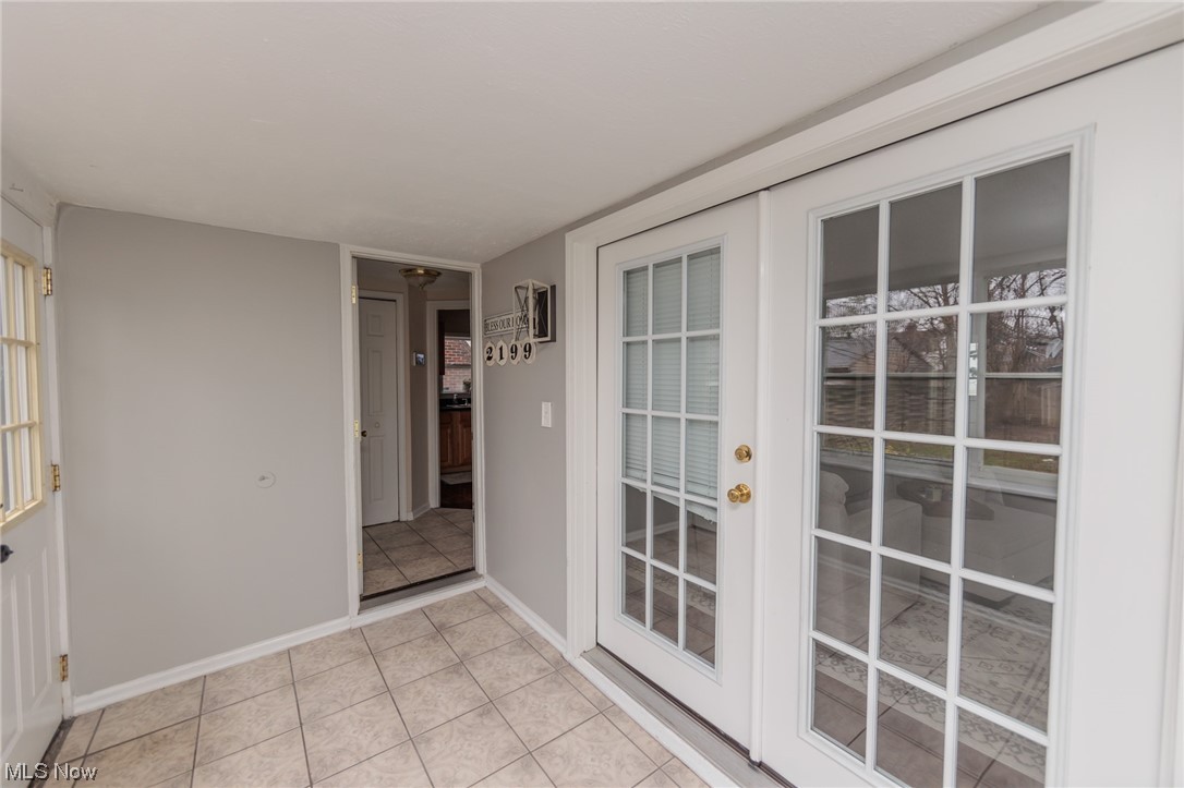2199 Cranston Road Cleveland, OH 44118 - Photo 4 of 40 Entryway featuring light tile flooring and french doors